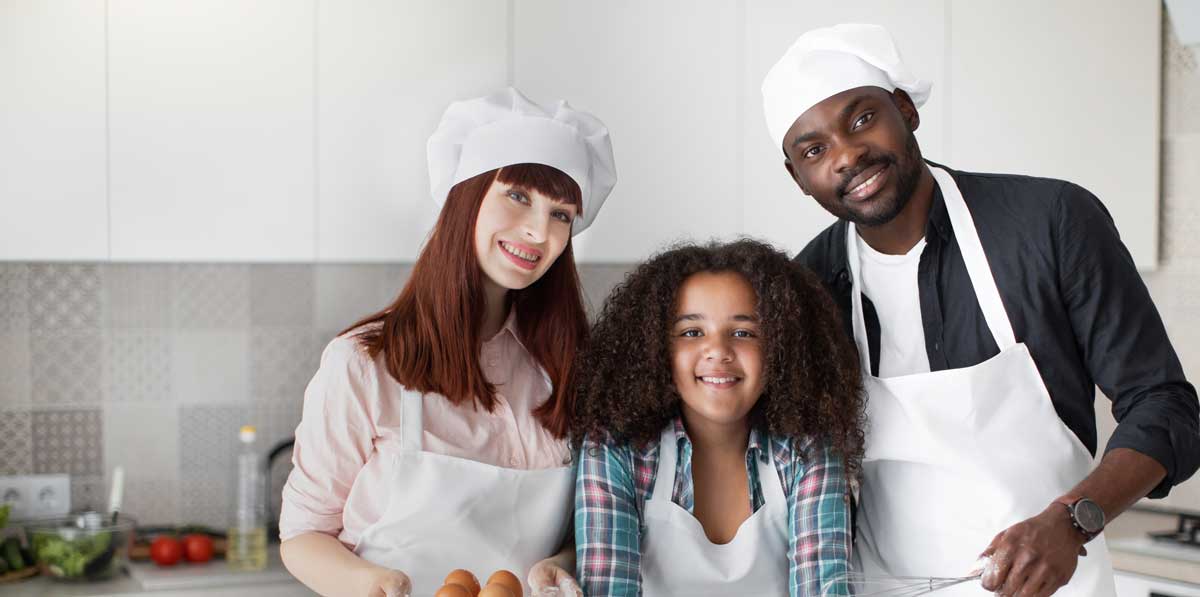 Image of a family cooking in the kitchen together